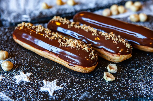 Traditional french eclairs with chocolate. Tasty dessert