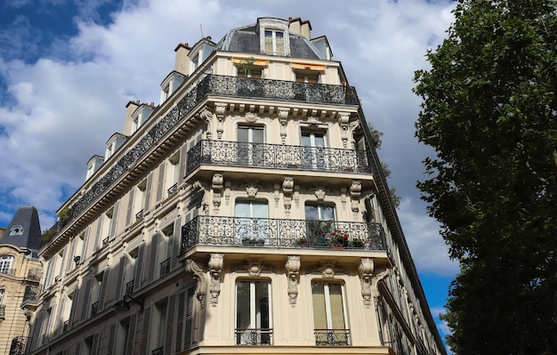 Traditional French house with typical balconies and windows Paris