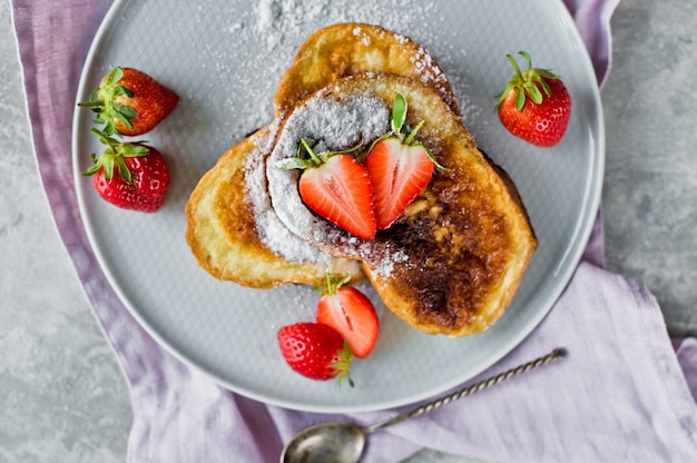 Traditional French toast with strawberries. 