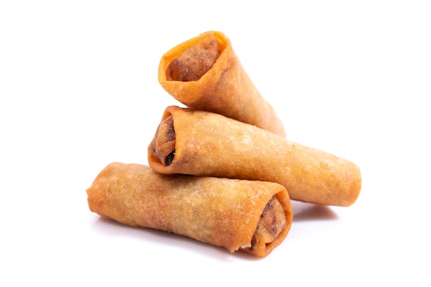 Traditional fried chinese crispy vegetable rolls isolated on a white background.