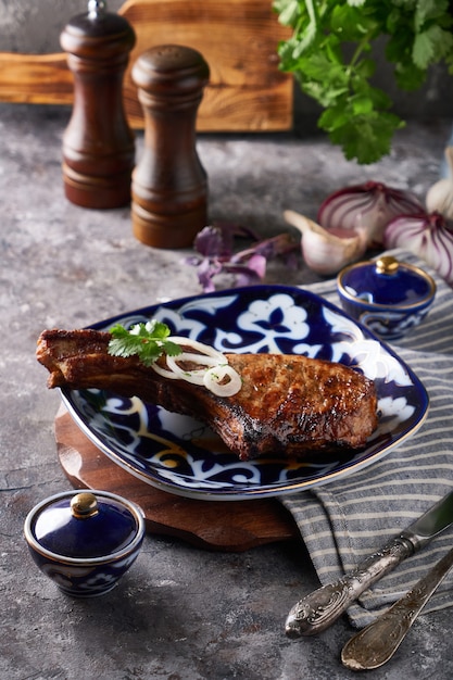 Traditional fried pork marinated with onions served on plate