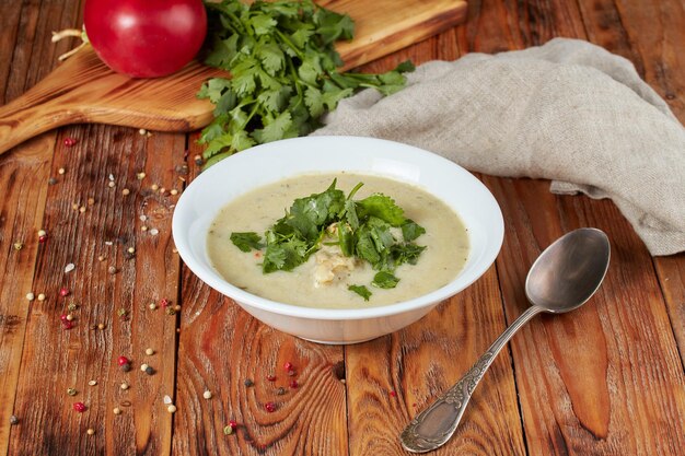 Traditional georgian chicken soup - chikhirtma in the soup plate