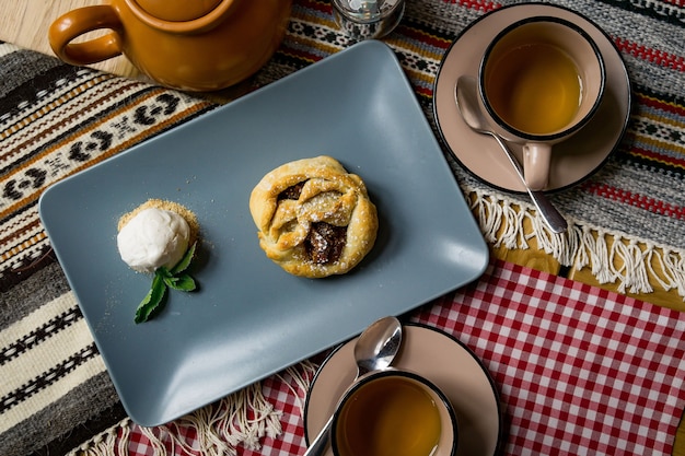 Traditional Georgian sweets and desserts with hazelnuts, walnuts, grape juice, honey, chocolate. Baklava, nakhini, churchkhela. Fresh fruits and candied fruits. Traditional Turkish coffee.