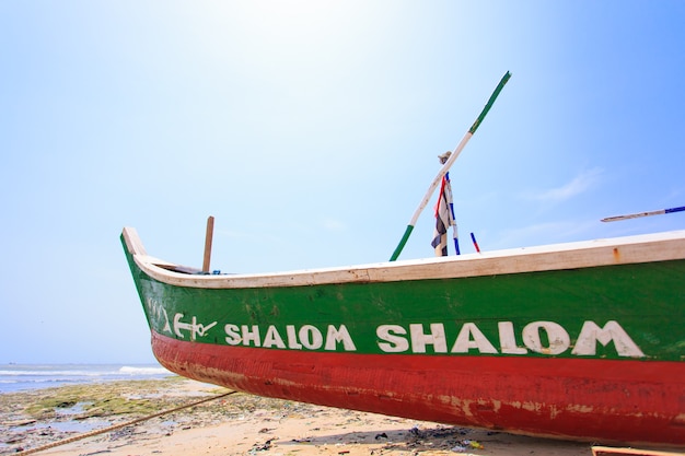 Traditional Ghanaian style wood boat on beach