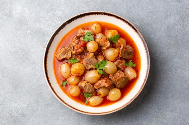 Traditional Greek dish of beef stifado in a sauce. Meat stew, onion stew. Turkish name; sogan yahni or et yahni