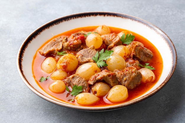 Traditional Greek dish of beef stifado in a sauce. Meat stew, onion stew. Turkish name; sogan yahni or et yahni