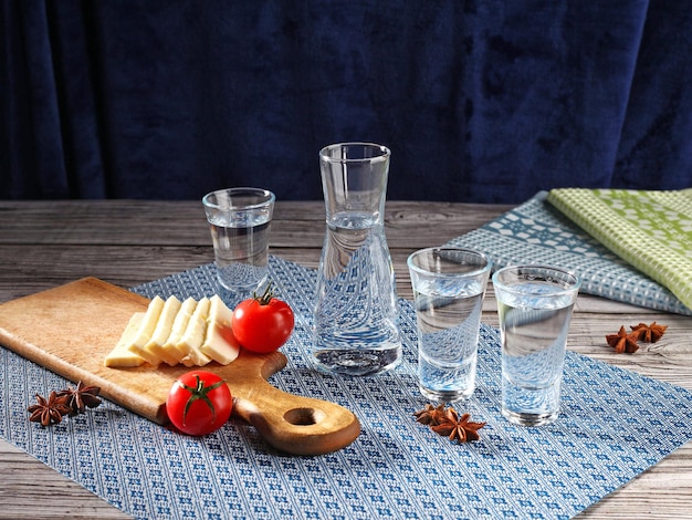 Traditional greek ouzo in shot glasses with appetizers