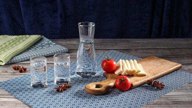 Traditional greek ouzo in shot glasses with appetizers