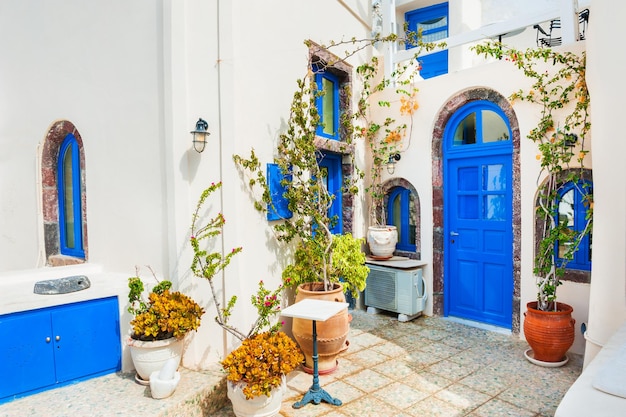 Traditional greek white architecture with blue doors and windows. Santorini island, Greece.