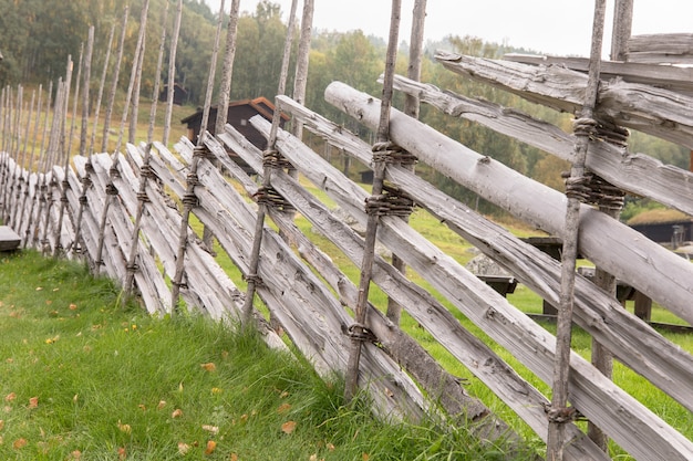 Traditional hand made roundpole fence in uvdal norway