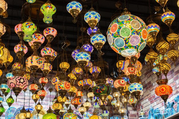 Traditional handmade turkish lamps in souvenir shop Mosaic of colored glass