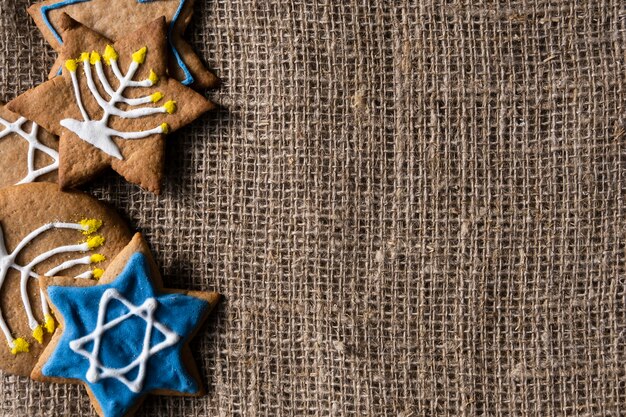 Traditional hanukkah cookies on burlap fabric