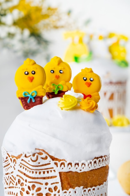 Traditional holiday Easter cakes decorated with chickens Greeting card on white background