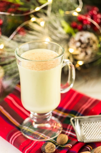 Traditional holiday egg nog garnished with freshly ground nutmeg.