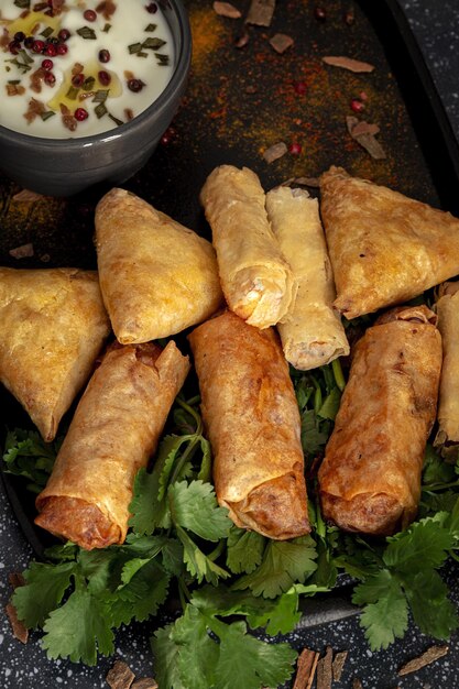 Traditional homemade assortment of moroccan food snacks on dark background. Typical Arab food. Halal concept