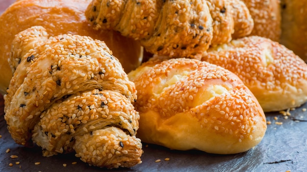 Traditional homemade bakery bread with sesame, Stack of fresh bread on table