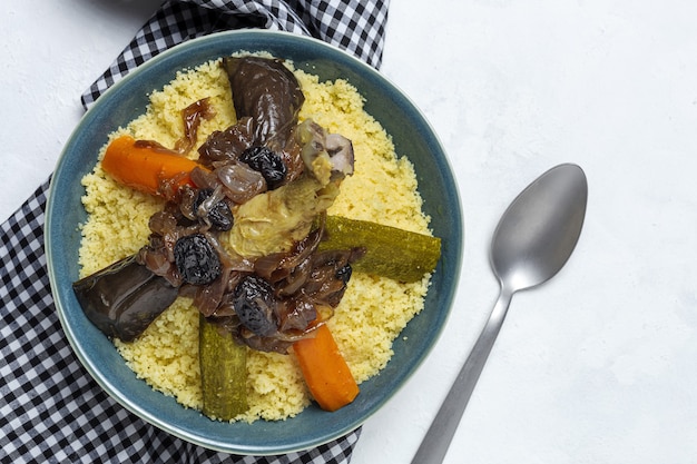 Traditional homemade couscous with chicken and vegetables from above. Arabic food. Moroccan food.