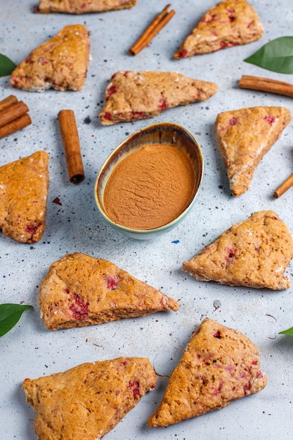 Traditional homemade English scones with frozen raspberries and cinnamon,top view