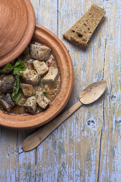 Traditional homemade fish tajin stew with potatoes. Moroccan food. Halal food