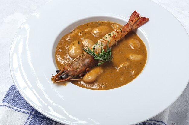 Traditional Homemade White Bean Stew with Prawns. Typical Spanish food