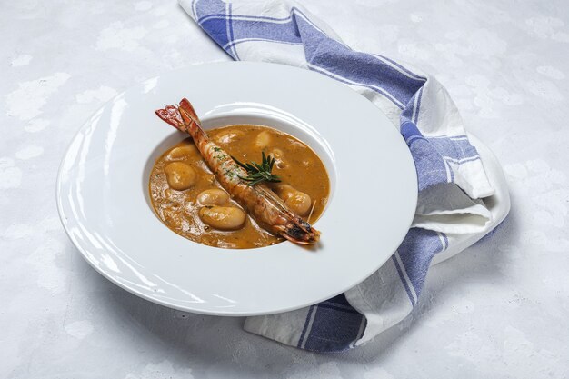 Traditional Homemade White Bean Stew with Prawns. Typical Spanish food