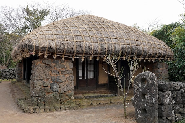 A traditional house with a thatched roof.