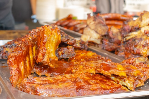 Traditional hungarian barbecue fried pork ribs on street food market