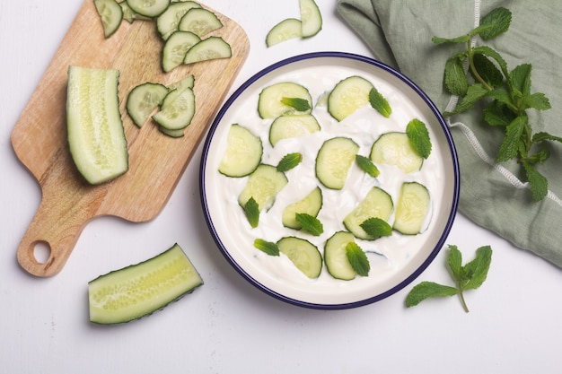 Traditional indian raita with cucumber, greek yoghurt and coriander, top view