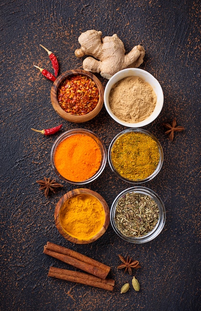 Traditional Indian spices on rusty background