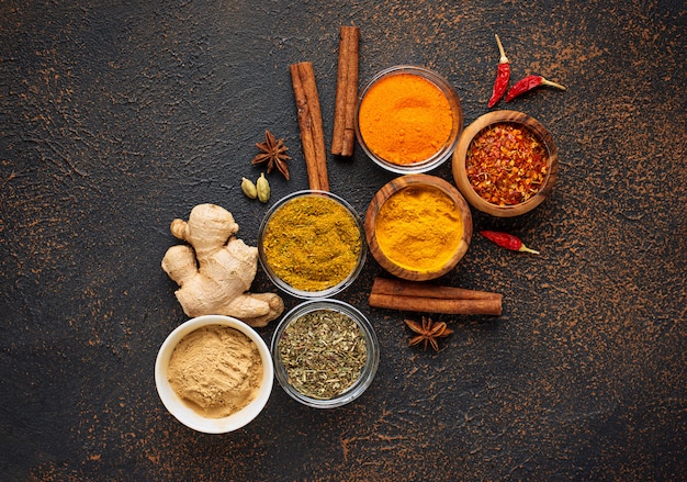 Traditional Indian spices on rusty background