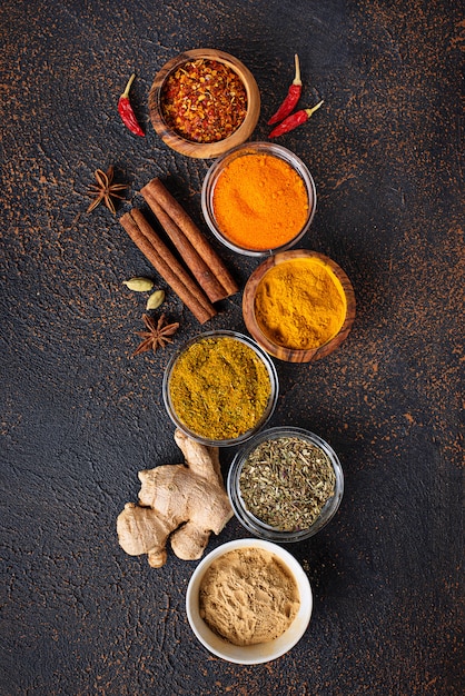 Traditional Indian spices on rusty background