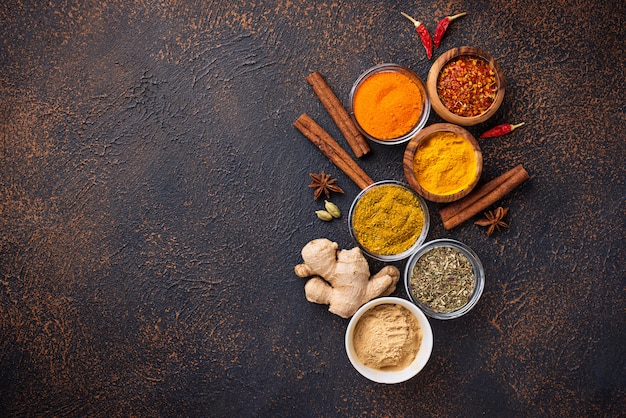 Traditional Indian spices on rusty background