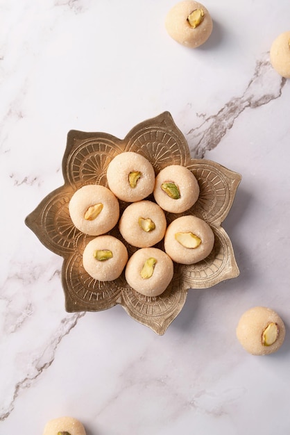 Traditional indian sweets burfi on marble background