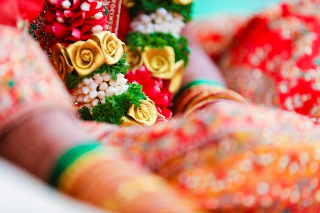 Traditional indian wedding ceremony, groom and bride hand