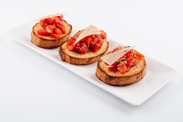 Traditional italian antipasto bruschetta appetizer with cherry tomatoes