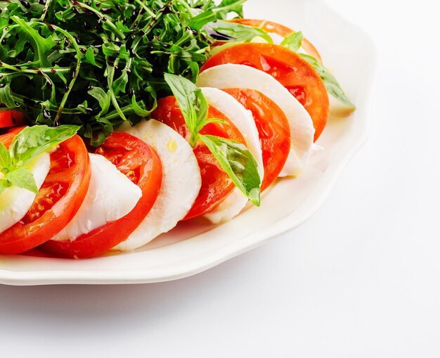 Traditional italian caprice salad tomato mozzarella cheese and basil