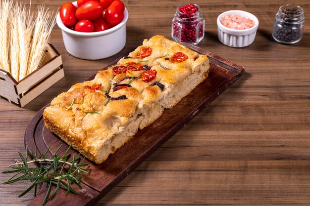 Traditional Italian Focaccia with cherry tomatoes and olives