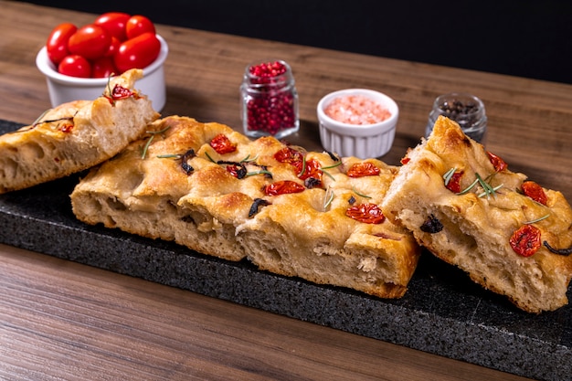 Traditional Italian Focaccia with cherry tomatoes and olives