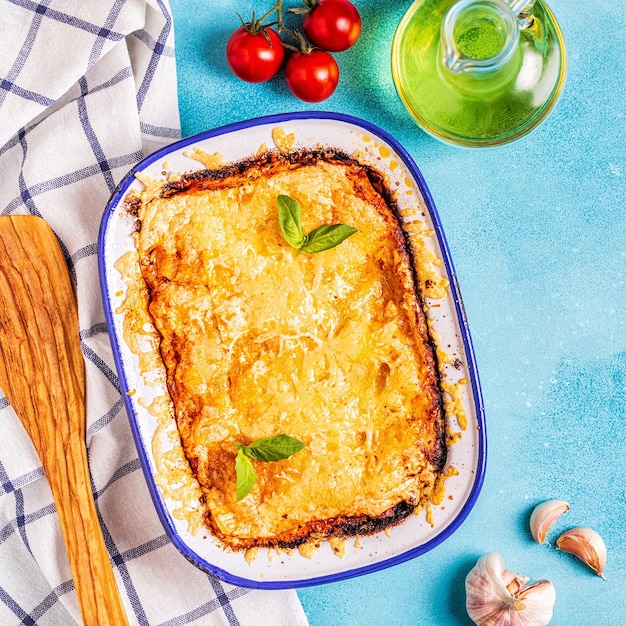 Traditional italian lasagna with vegetables, minced meat and cheese, top view, copy space.