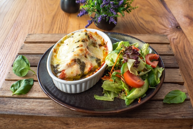 Traditional italian lasagna with vegetables minced meat and cheese