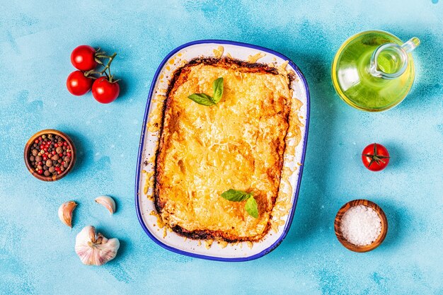 Traditional italian lasagna with vegetables, minced meat and cheese