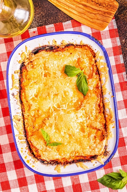 Traditional italian lasagna with vegetables, minced meat and cheese