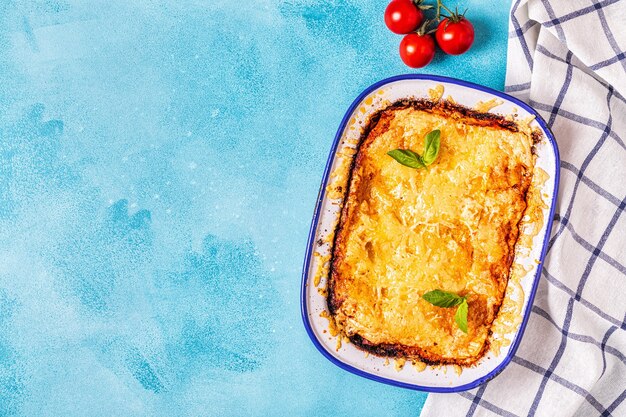 Traditional italian lasagna with vegetables minced meat and cheese