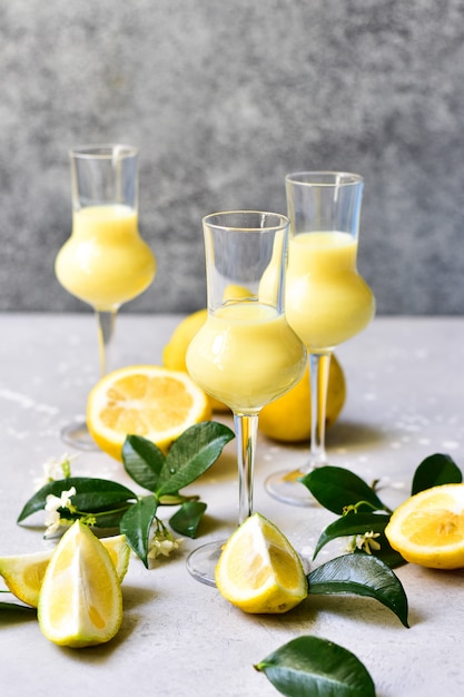 traditional Italian liqueur Limoncello with lemons and cream