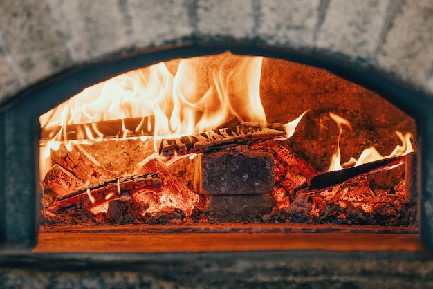 Traditional Italian oven with bright fire