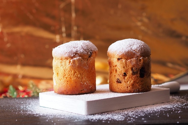 Traditional Italian panettones on a gold background