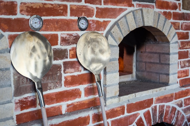 Traditional italian Pizza oven burning wood and flames in fireplace