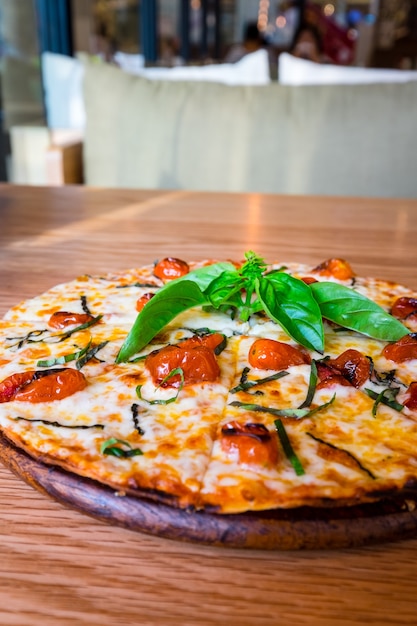 Traditional Italian pizza on wooden board