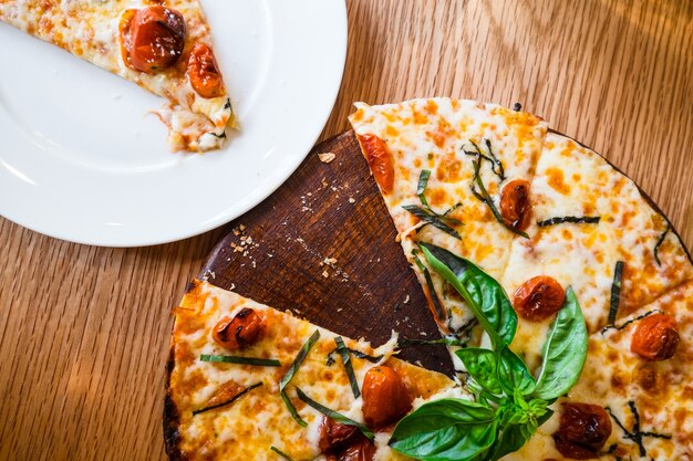 Traditional Italian pizza on wooden board