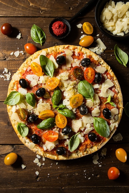 Traditional italian pizza on wooden table